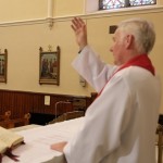Fr. Mangan blessing his Parishioners on Good Friday