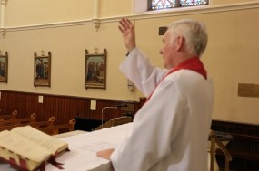 Fr. Mangan blessing his Parishioners on Good Friday