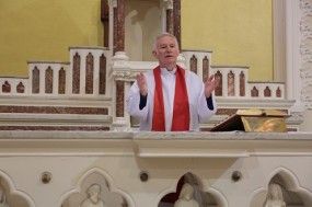 Fr. Mangan blessing his parishioners on Good Friday