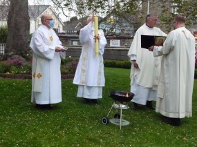 Lighting Pascal Candle at Easter Vigil Mass